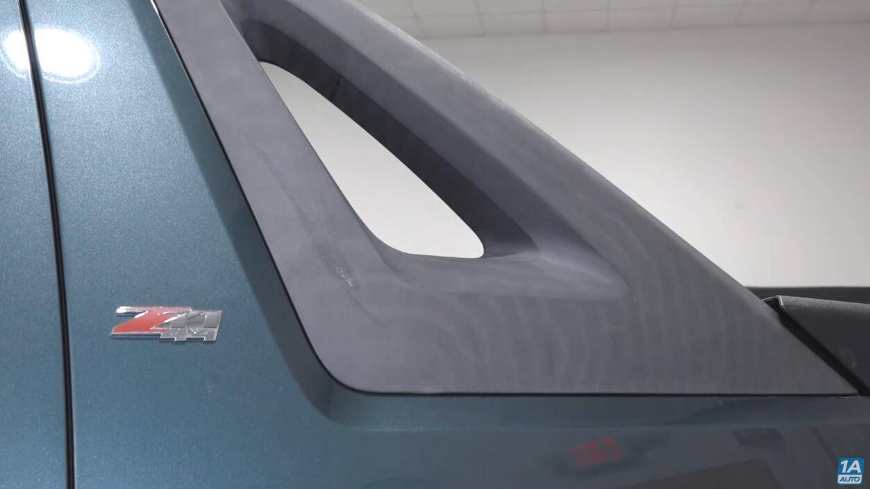 Slate Auto Pickup Truck Embracing Visible Wear and Tear (Shark Battle Scars) 1749805343425-06